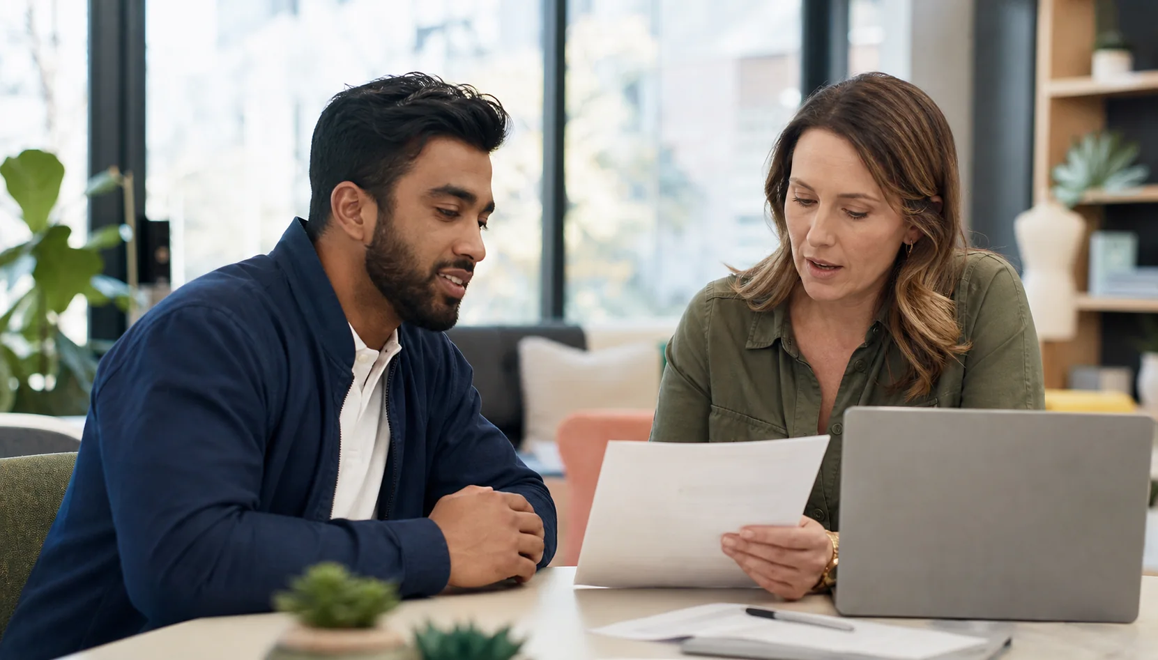 Newcomer reviewing career opportunities with an employment advisor