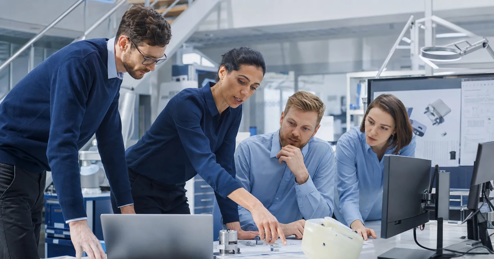 Diverse skilled workers solving an engineering task together
